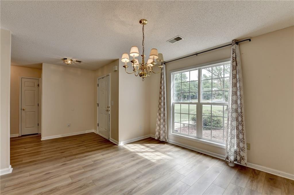 601 Bowling Lane Winder, GA 30680 - Photo 7 of 45 a view of a livingroom with wooden floor and a window