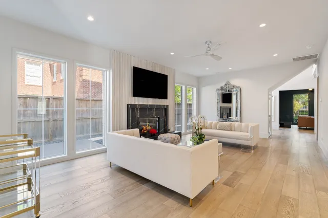a living room with fireplace furniture and a flat screen tv