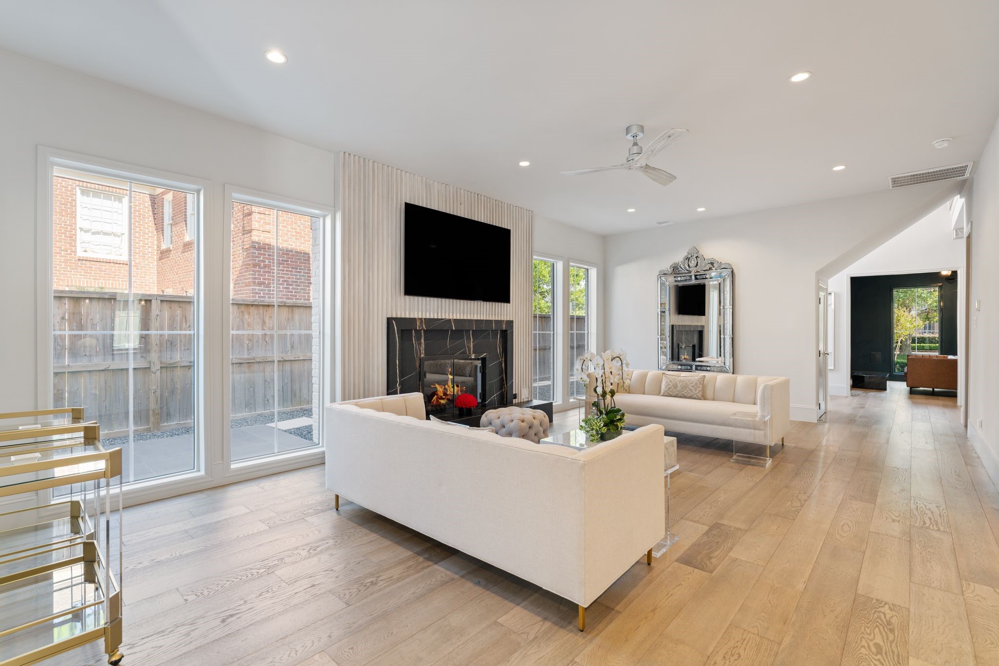 6012 Riverview Way Houston, TX 77057 - Photo 15 of 50 a living room with fireplace furniture and a flat screen tv