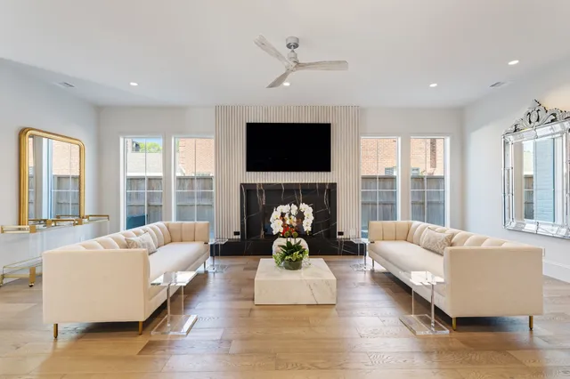 a living room with fireplace furniture and a flat screen tv