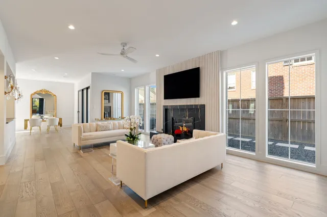 a living room with fireplace furniture and a flat screen tv