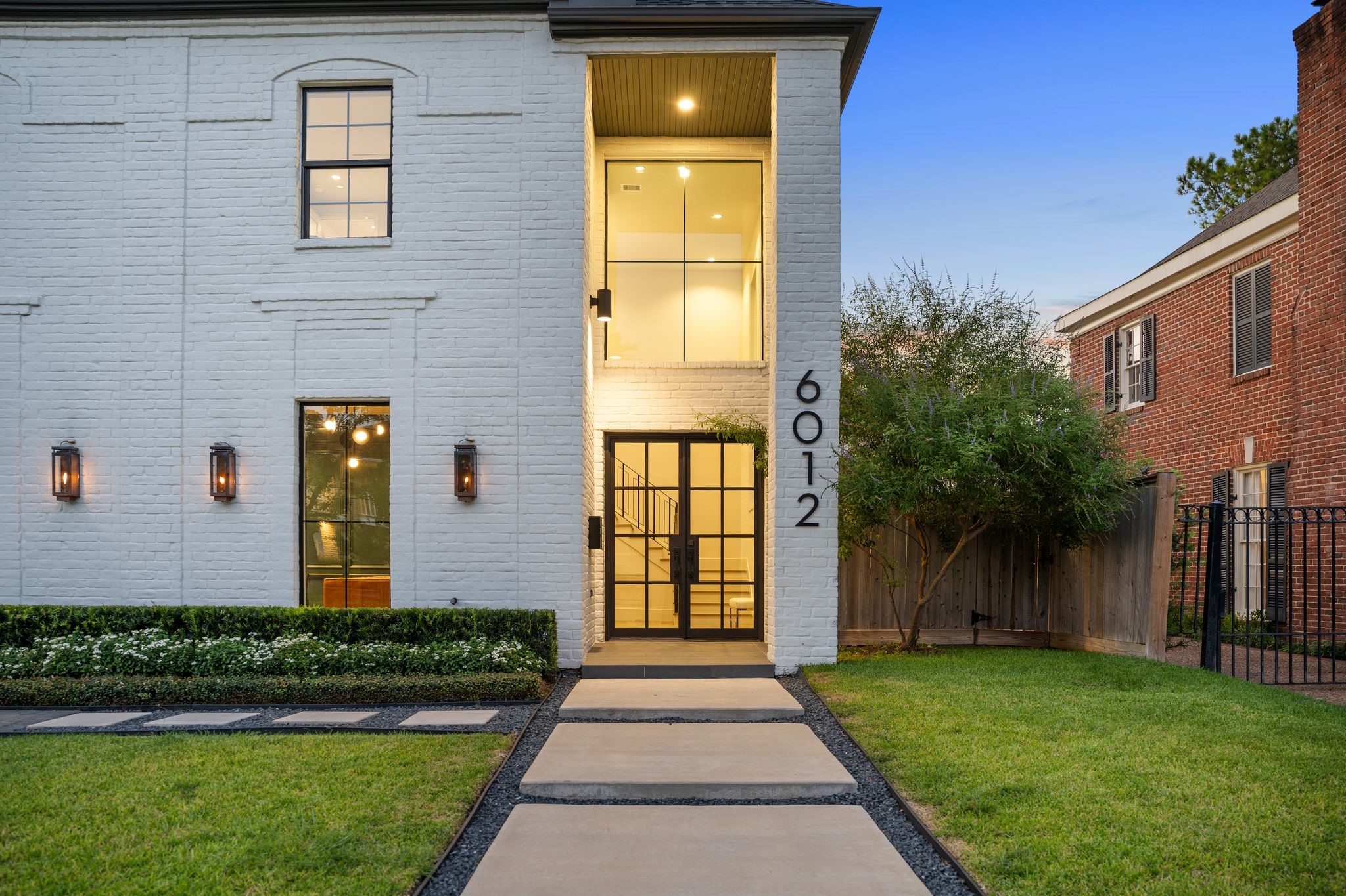 6012 Riverview Way Houston, TX 77057 - Photo 2 of 50 a front view of a house having yard
