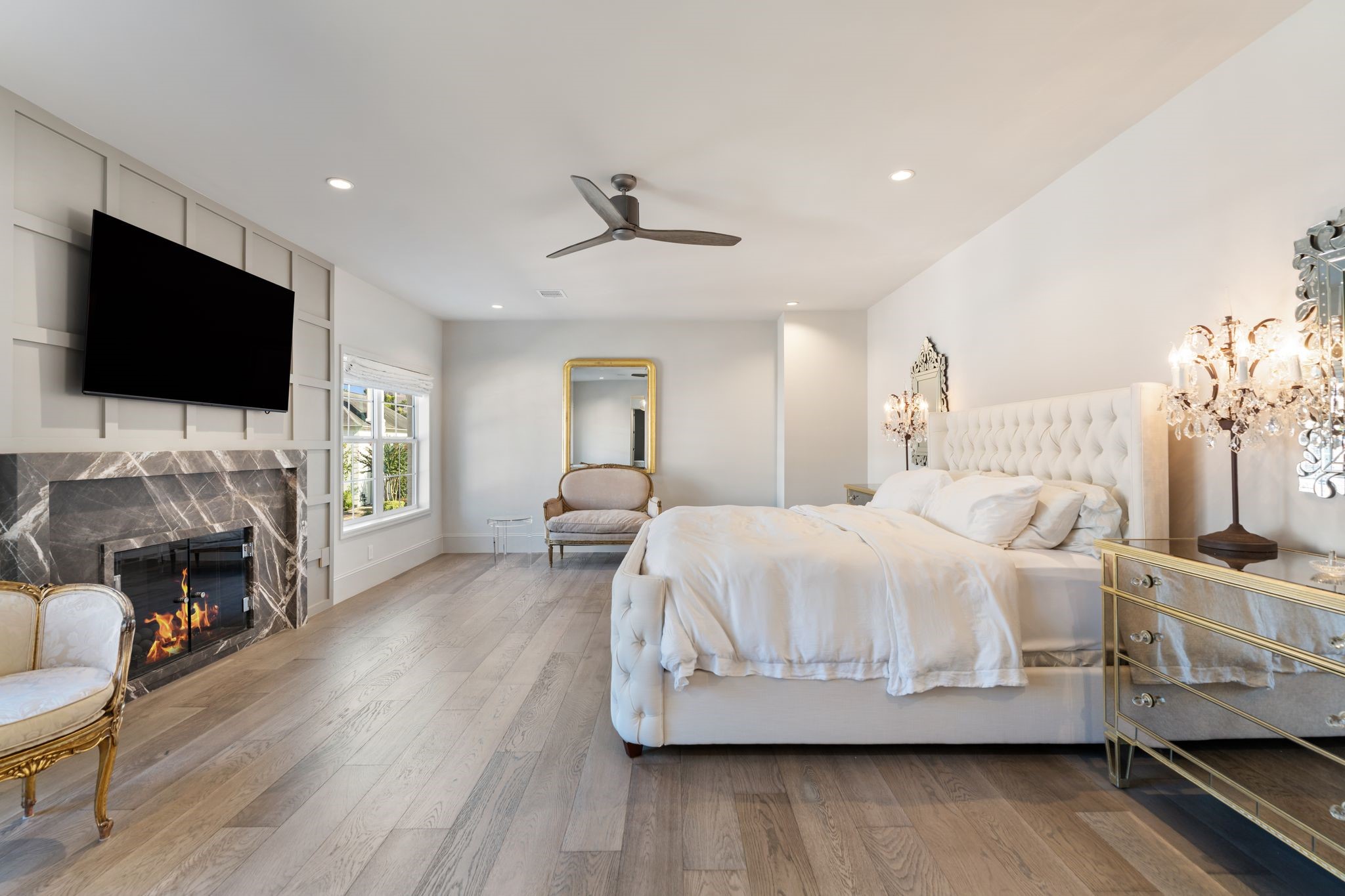 6012 Riverview Way Houston, TX 77057 - Photo 22 of 50 a spacious bedroom with a bed and a flat screen tv