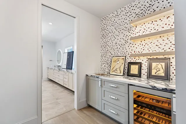 a bathroom with a double vanity sink mirror and