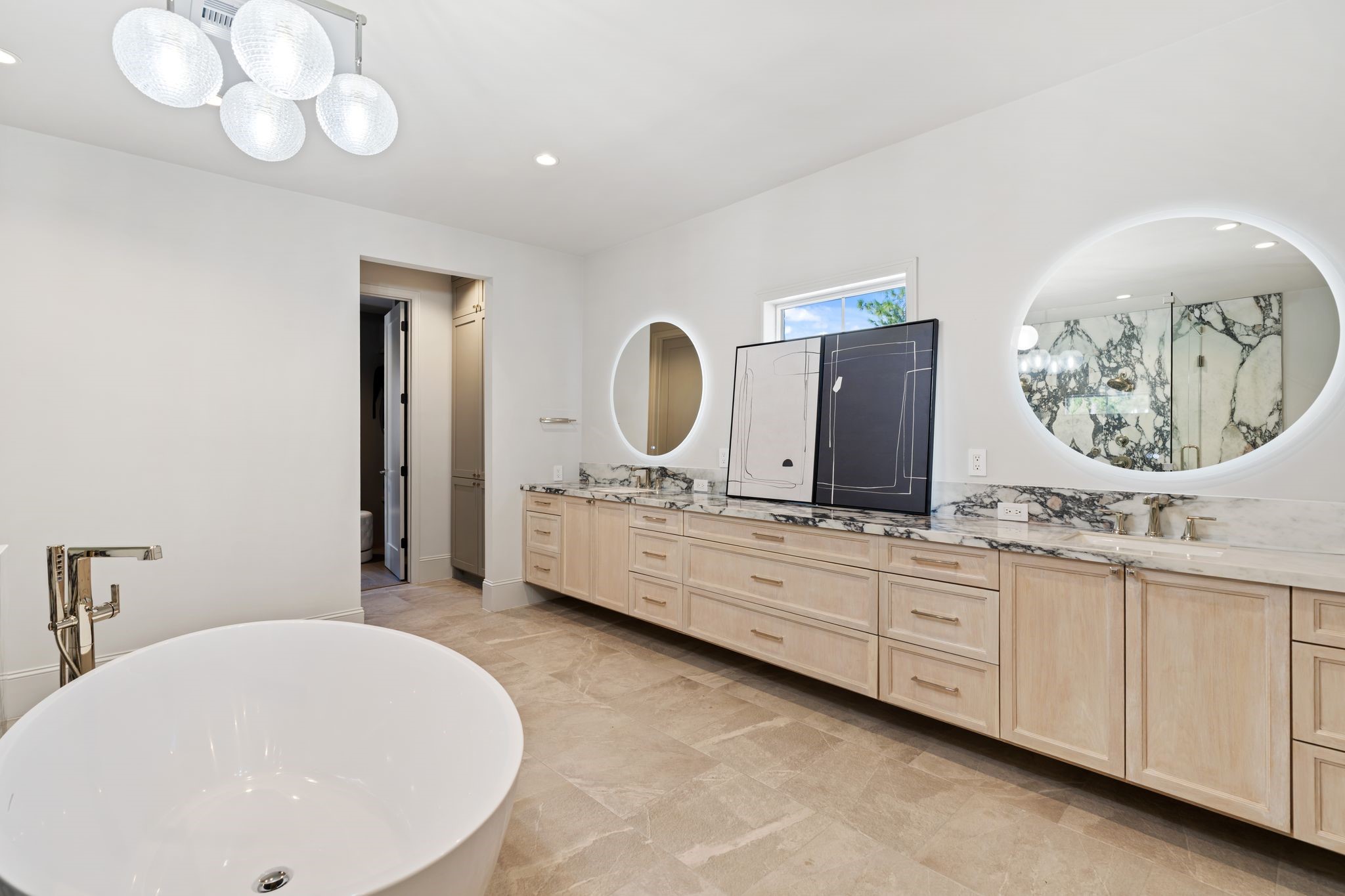 6012 Riverview Way Houston, TX 77057 - Photo 26 of 50 a bathroom with a double vanity sink and a mirror