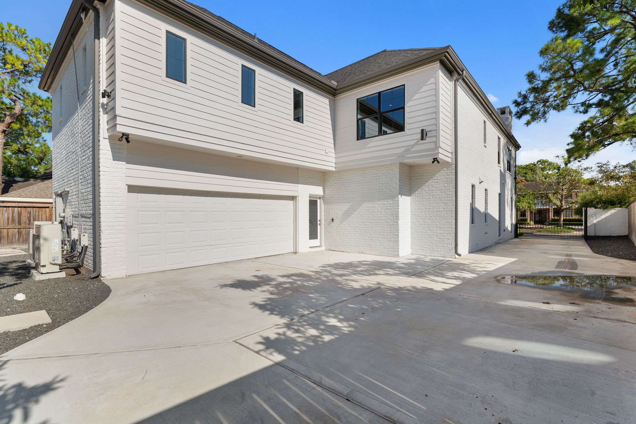 6012 Riverview Way Houston, TX 77057 - Photo 43 of 50 a view of a white house with a street