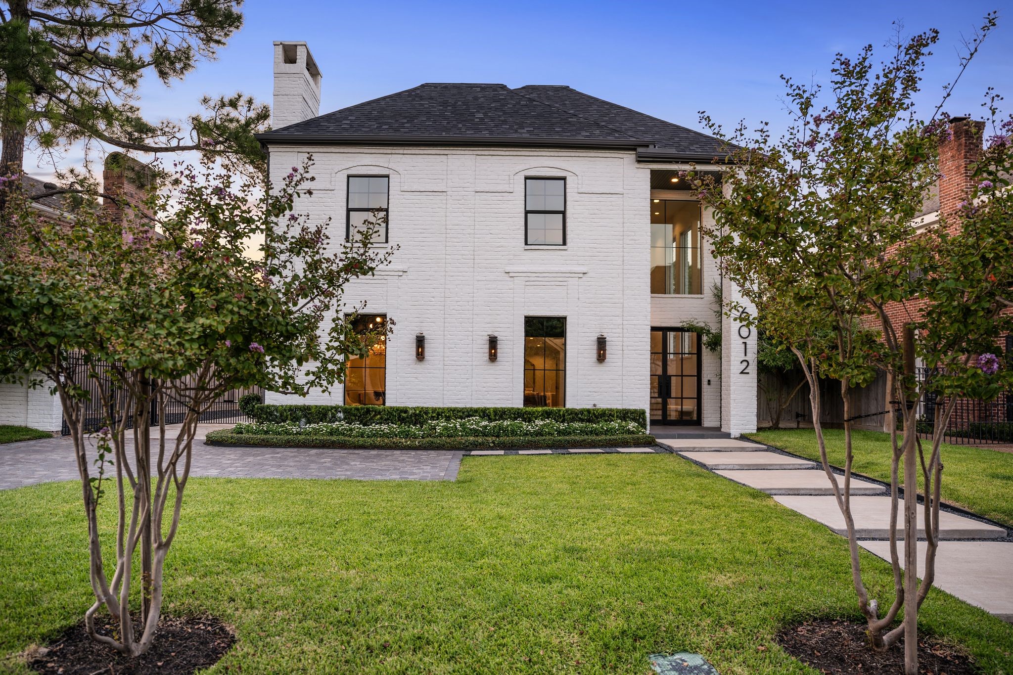 6012 Riverview Way Houston, TX 77057 - Photo 50 of 50 a front view of a house with a yard