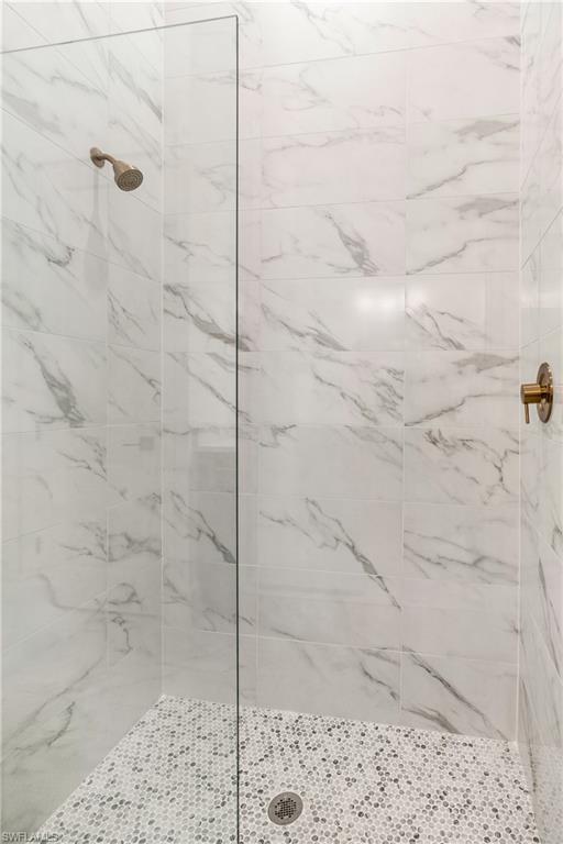 9560 Caymas Terrace Naples, FL 34114 - Photo 19 of 40 a bathroom with a shower