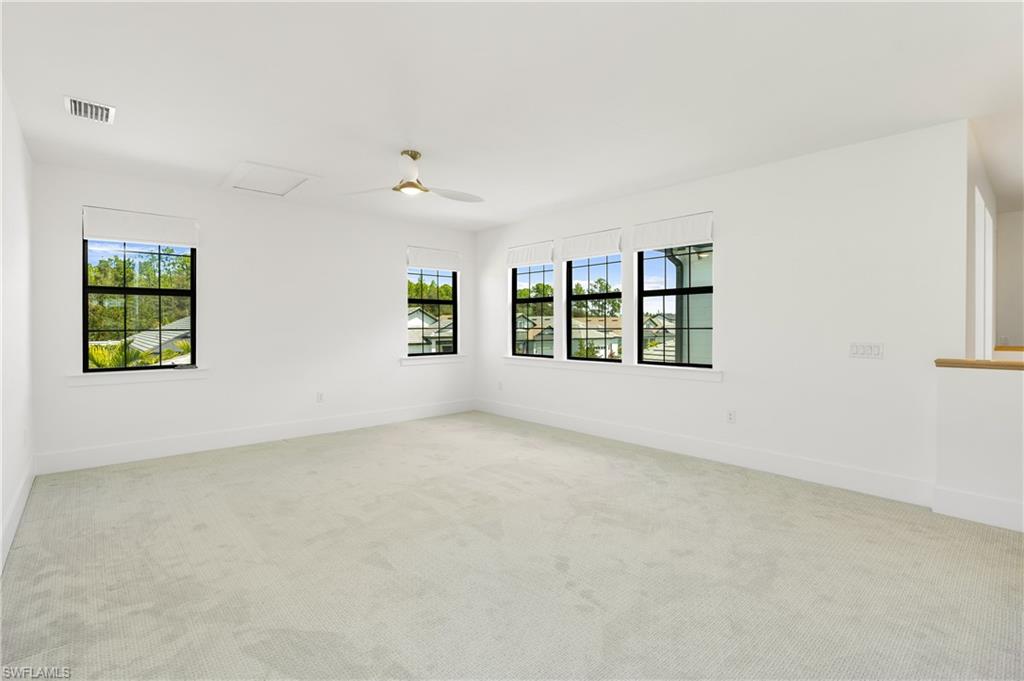9560 Caymas Terrace Naples, FL 34114 - Photo 22 of 40 an empty room with windows