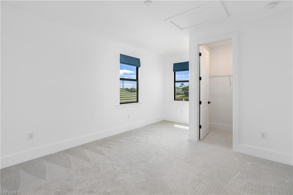9560 Caymas Terrace Naples, FL 34114 - Photo 25 of 40 an empty room with windows