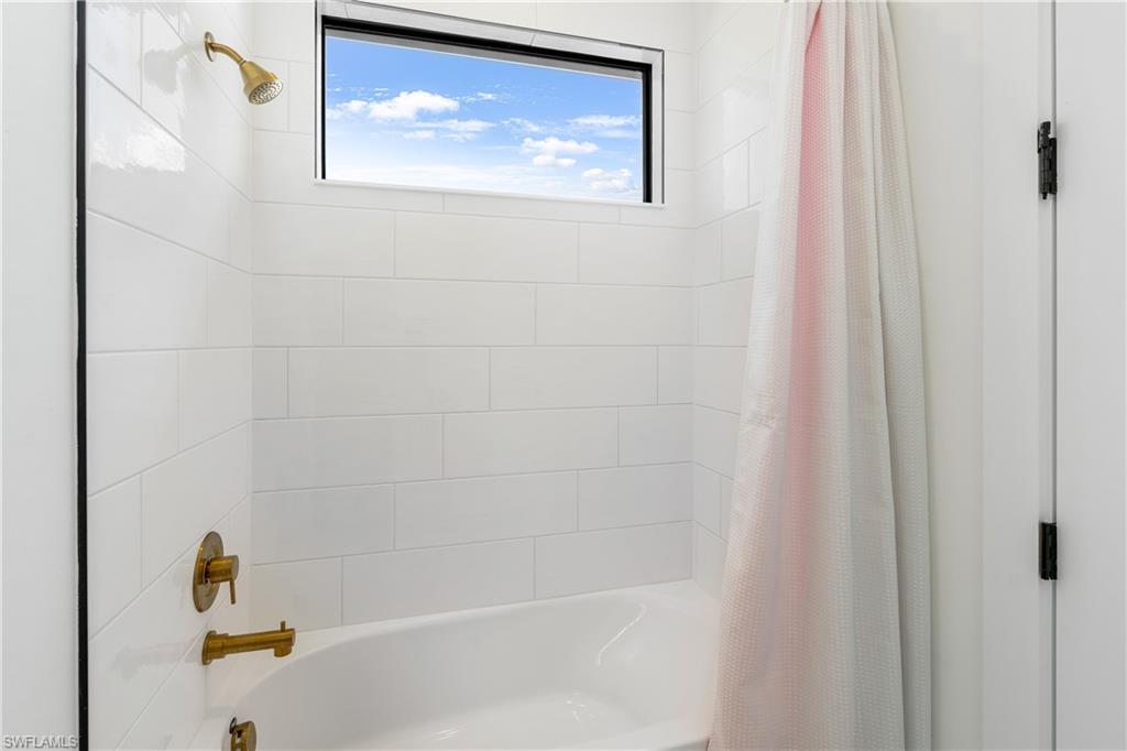 9560 Caymas Terrace Naples, FL 34114 - Photo 27 of 40 a bathroom with a bathtub
