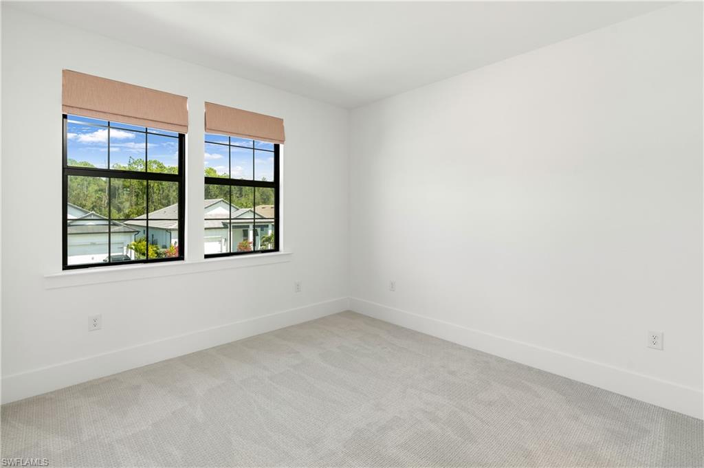 9560 Caymas Terrace Naples, FL 34114 - Photo 28 of 40 an empty room with windows