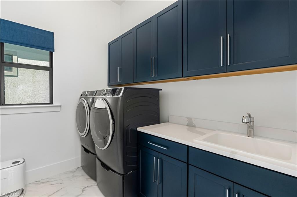 9560 Caymas Terrace Naples, FL 34114 - Photo 29 of 40 a utility room with cabinets