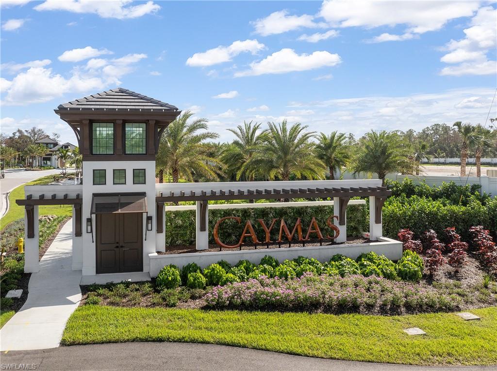 9560 Caymas Terrace Naples, FL 34114 - Photo 37 of 40 front view of a house with a yard