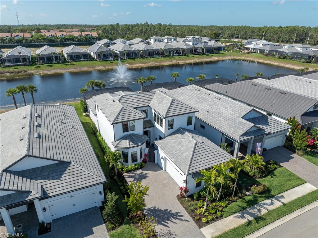9560 Caymas Terrace Naples, FL 34114 - Photo 40 of 40 an aerial view of a house with outdoor space lake view and mountain view