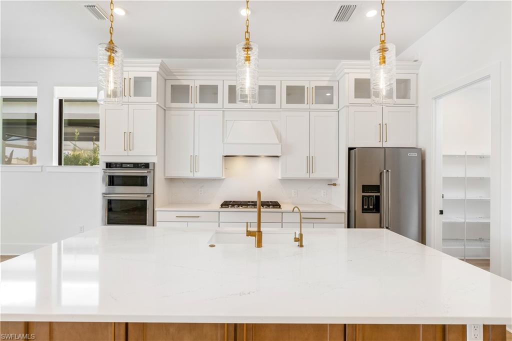 9560 Caymas Terrace Naples, FL 34114 - Photo 5 of 40 a view of kitchen with stainless steel appliances