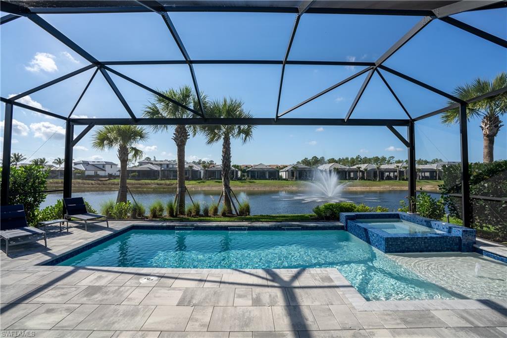 9560 Caymas Terrace Naples, FL 34114 - Photo 8 of 40 a view of a swimming pool with a patio