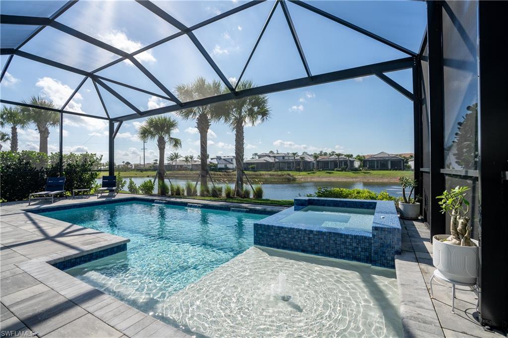 9560 Caymas Terrace Naples, FL 34114 - Photo 9 of 40 a view of swimming pool with a patio