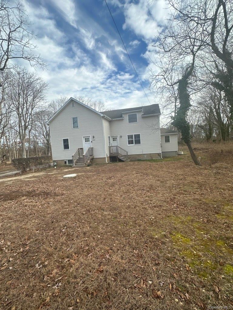 493 Munsell Road East Patchogue, NY 11772 - Photo 2 of 14 a view of a house with a yard