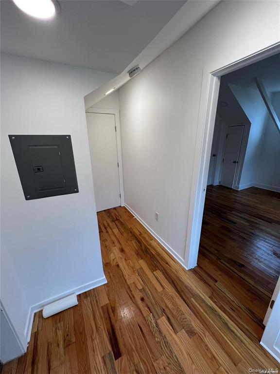 493 Munsell Road East Patchogue, NY 11772 - Photo 8 of 14 a view of a room with wooden floor