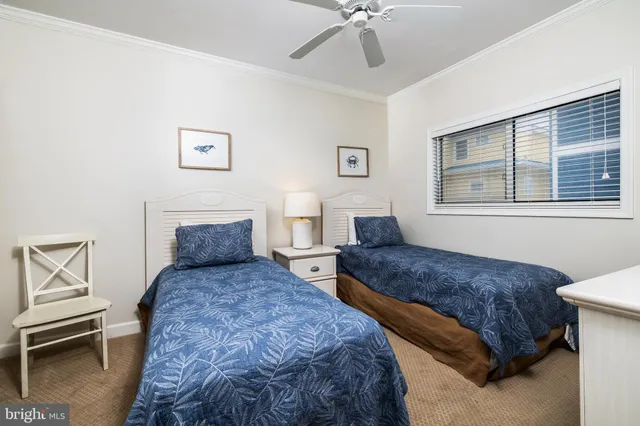 a bedroom with double bed and a window