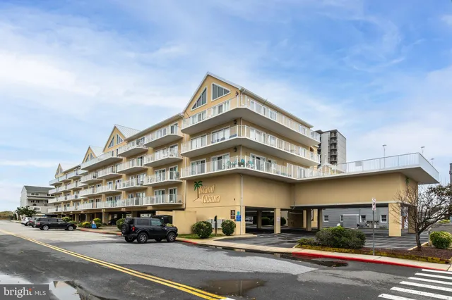 a building with a street sign on a road