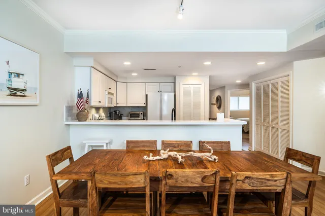 a kitchen with a table and chairs in it