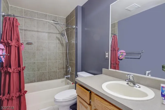 a bathroom with a sink a toilet and a bathtub