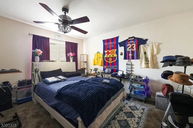 a bedroom with bed and furniture