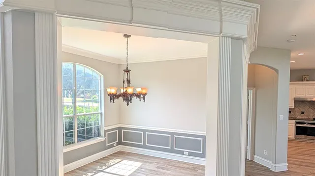 a bathroom with a granite countertop sink a large mirror and a bathtub