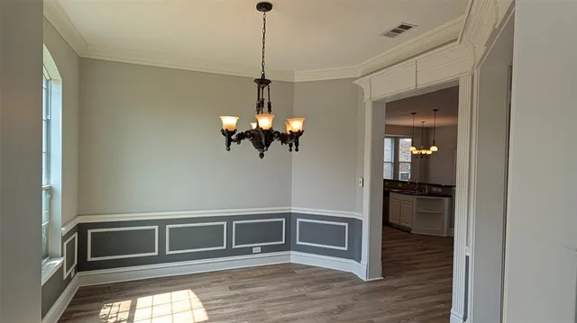a kitchen with stainless steel appliances granite countertop a refrigerator and a stove