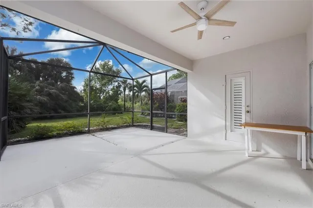 a view of a house with a porch and a yard