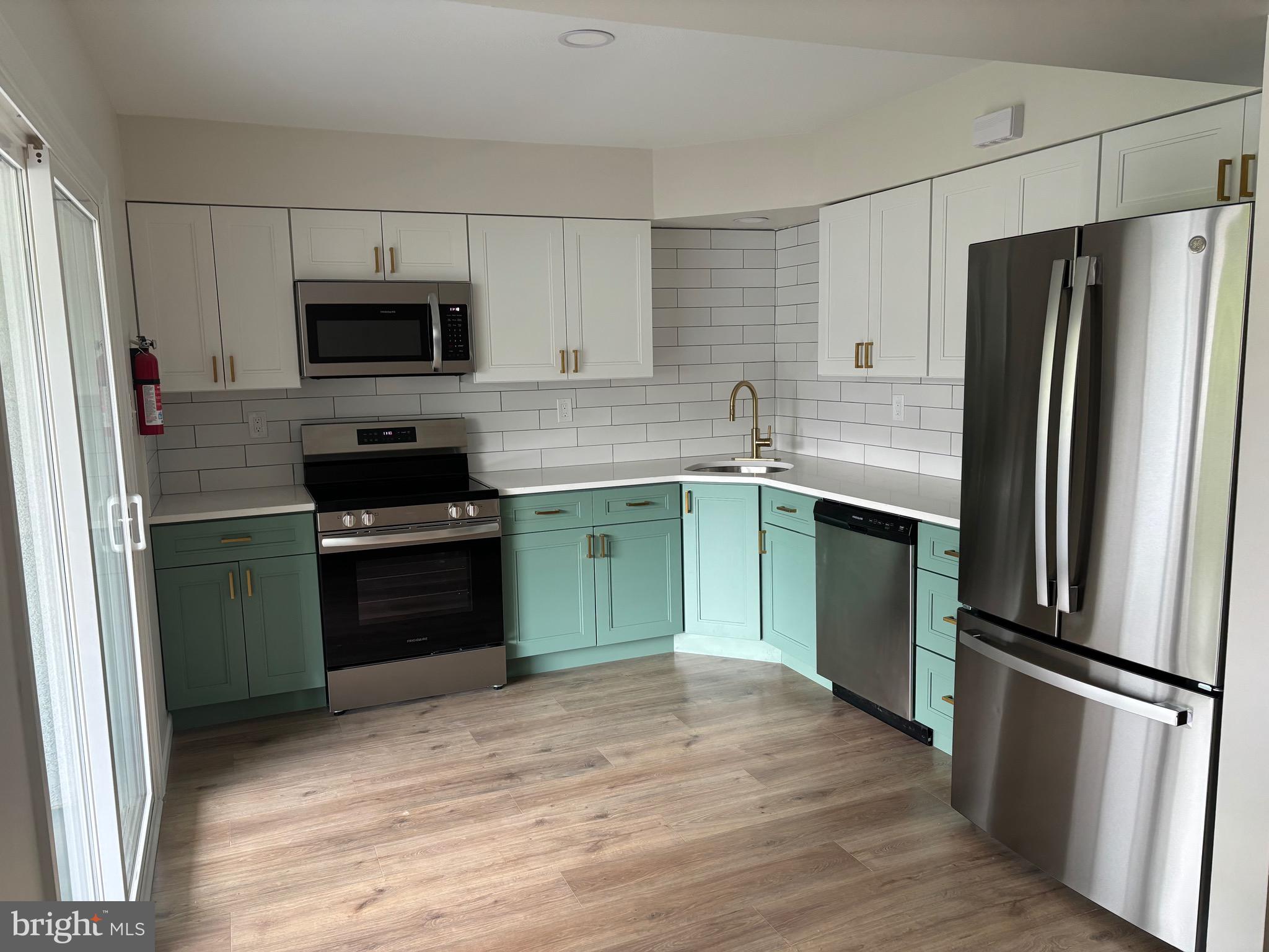 122 Harvest Lane Phoenixville, PA 19460 - Photo 1 of 28 a kitchen with a refrigerator and a sink