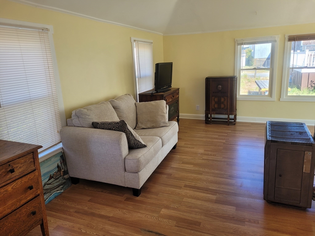 101 Cable Avenue Salisbury, MA 01952 - Photo 8 of 16 a living room with furniture and a flat screen tv