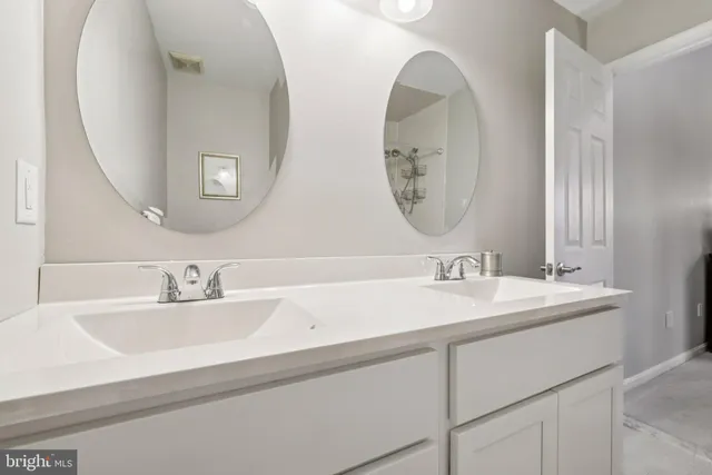 a bathroom with a bathtub with shower
