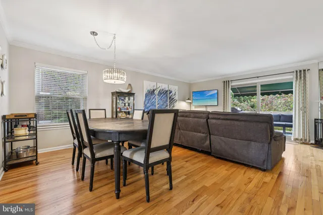 a room with pool table and windows