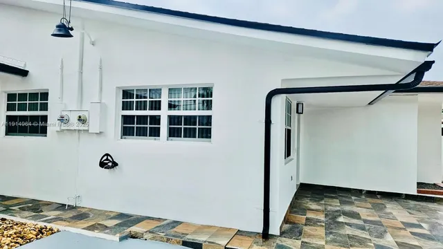 a view of empty room with windows