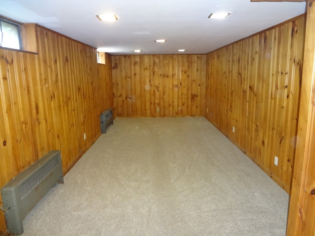 27 Bennington Street Springfield, MA 01108 - Photo 13 of 20 a view of a hallway with a wooden door