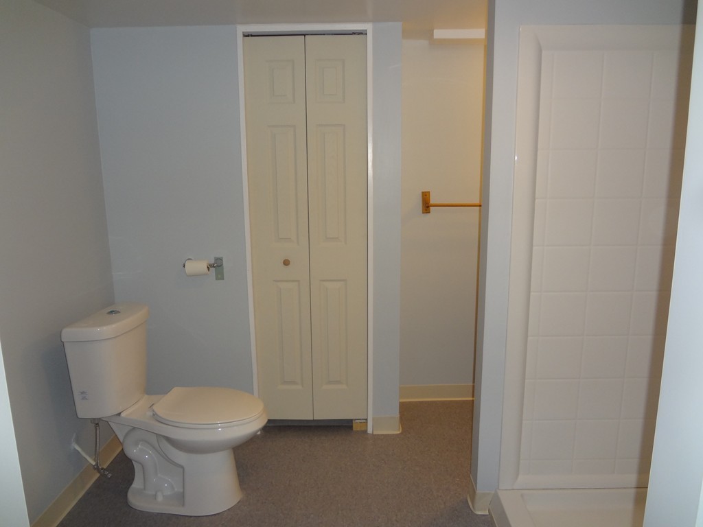 27 Bennington Street Springfield, MA 01108 - Photo 14 of 20 a white toilet sitting next to a bathroom sink