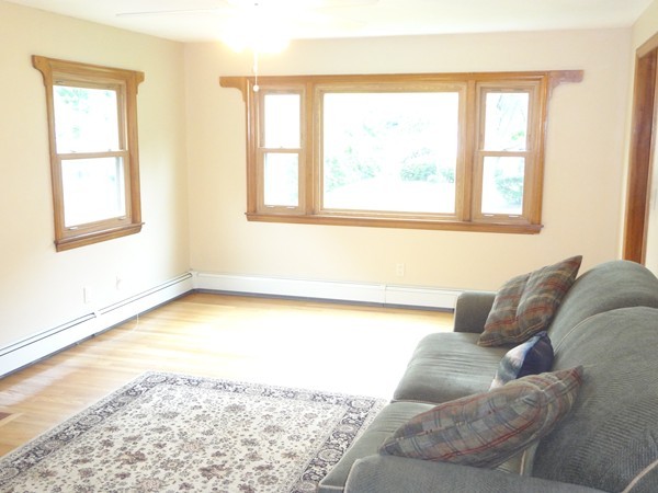 27 Bennington Street Springfield, MA 01108 - Photo 6 of 20 a living room with a bed furniture and a window