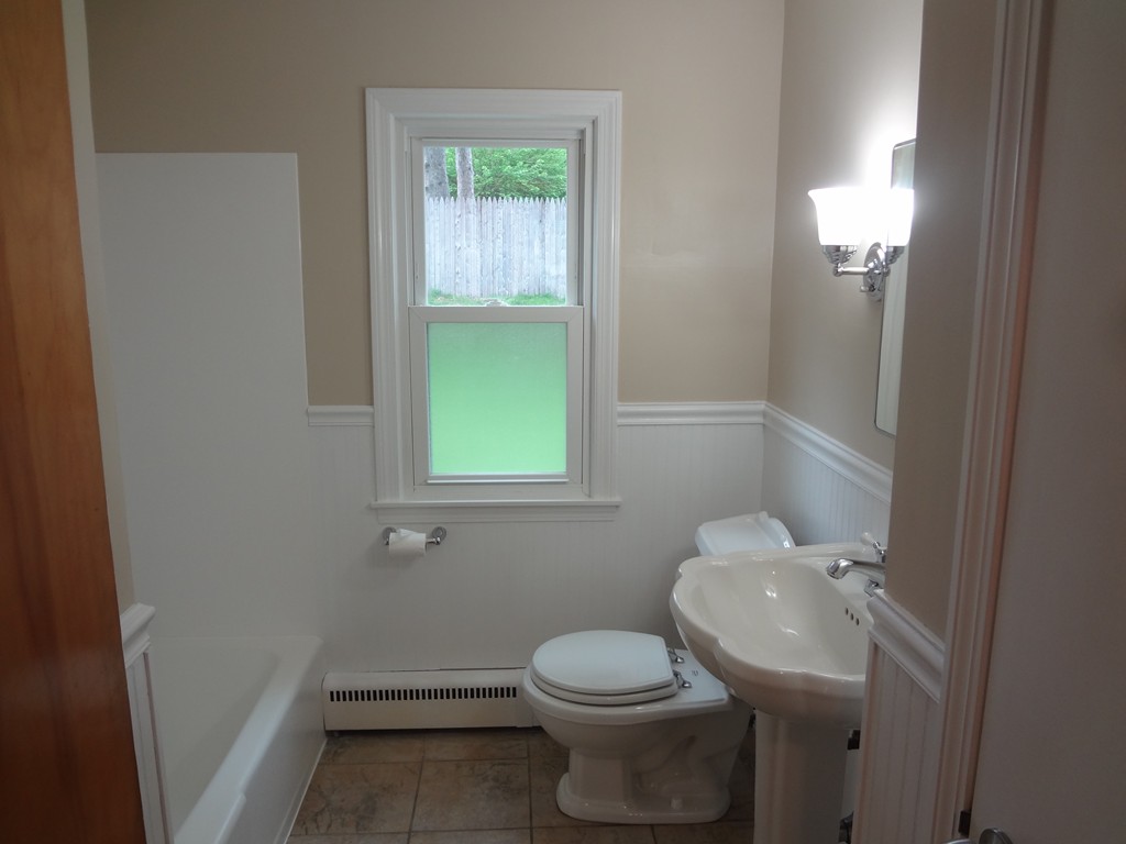 27 Bennington Street Springfield, MA 01108 - Photo 9 of 20 a bathroom with a toilet and a sink