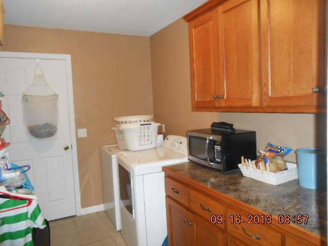 7063 Oak Springs Road Nunnelly, TN 37137 - Photo 11 of 16 cabinets in utility room