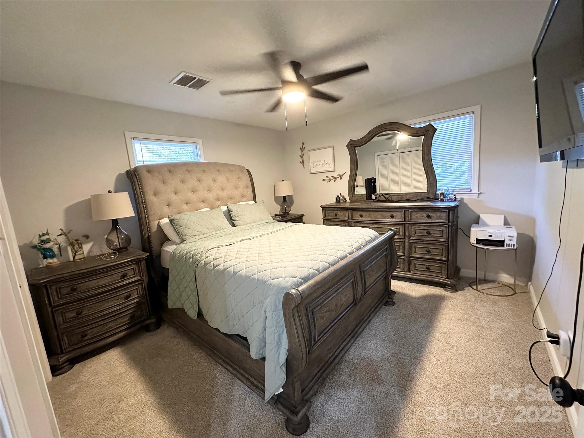 400 Charles Street Spencer, NC 28159 - Photo 18 of 26 a large bedroom with a bed and dresser
