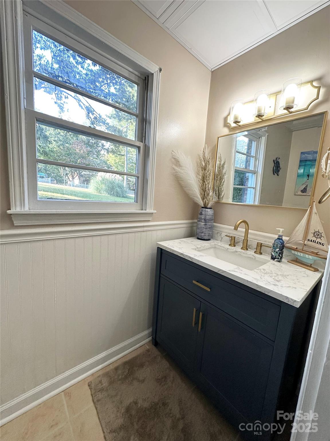400 Charles Street Spencer, NC 28159 - Photo 22 of 26 a bathroom with a sink vanity and a mirror