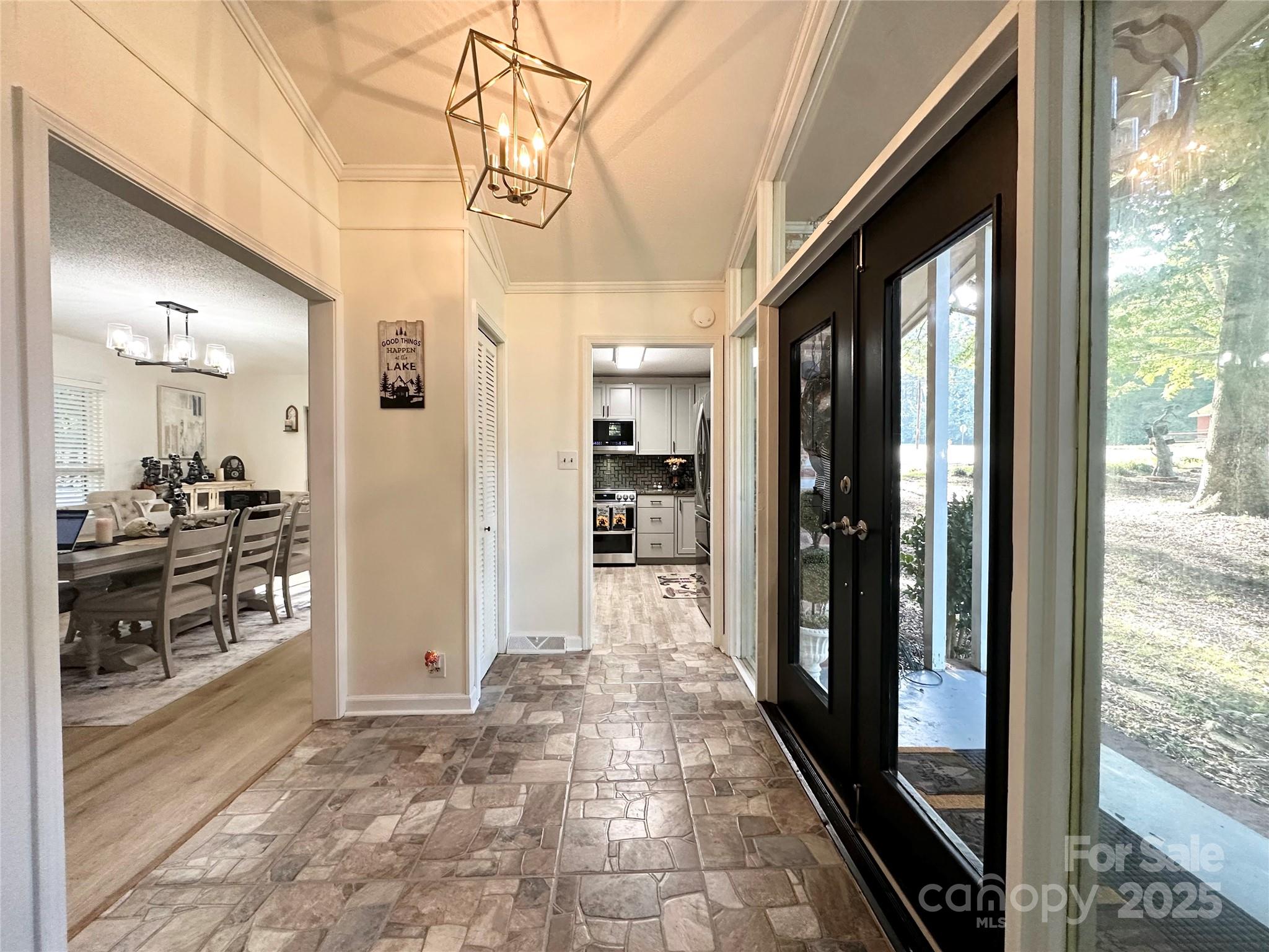 400 Charles Street Spencer, NC 28159 - Photo 5 of 26 a view of a hallway with wooden floor and living room