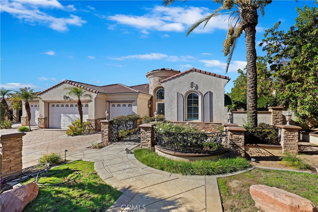 7525 Wood Road Riverside, CA 92508 - Photo 1 of 1 a front view of a house with garden