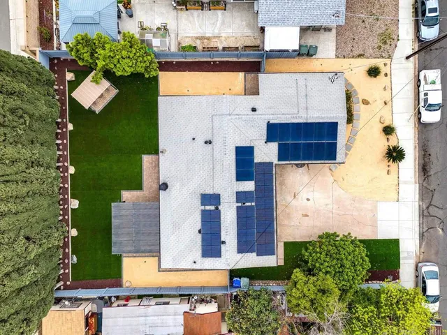 an aerial view of residential houses with outdoor space