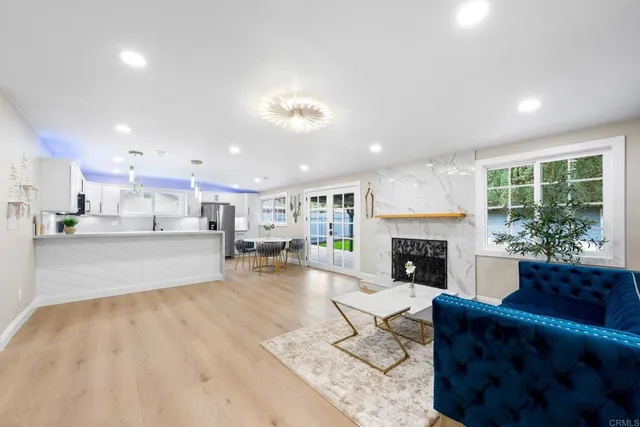 a kitchen with a sink a window and cabinets