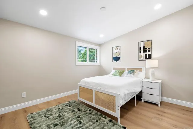 a bedroom with bed and a window