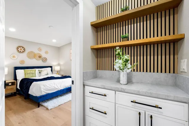 a bedroom with a bed and a window